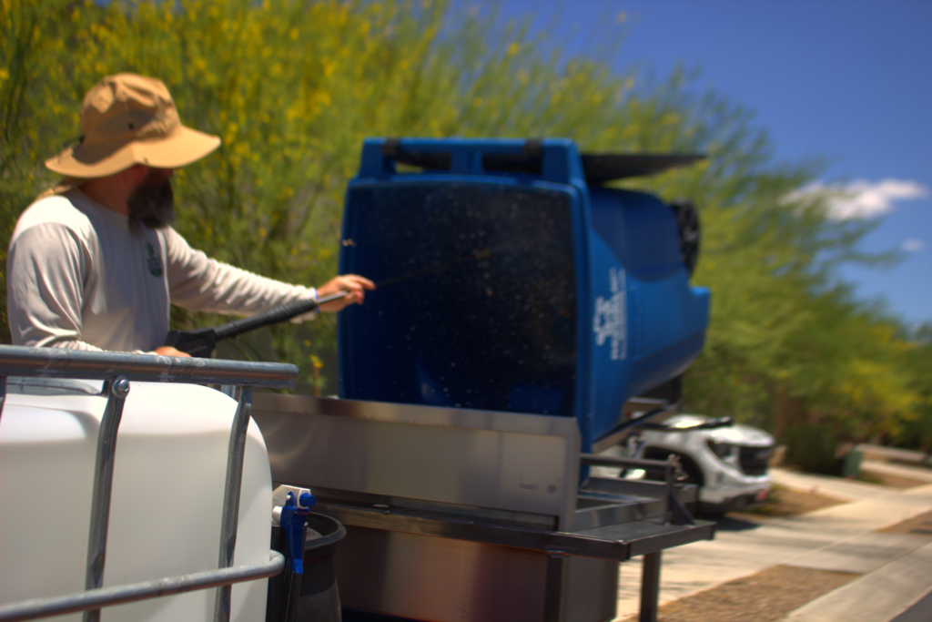 Saguaro Sanitation cleaning a residential trash bin